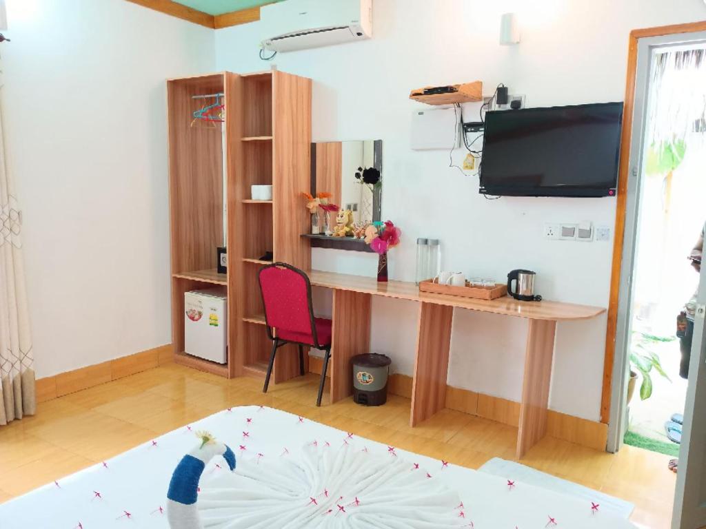 TV a/nebo společenská místnost v ubytování Olhumathi View Inn