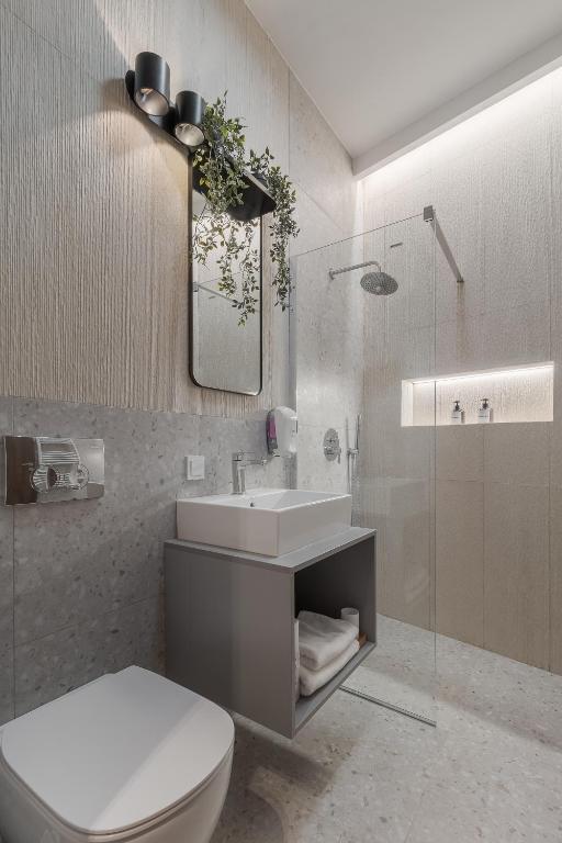 Koupelna v ubytování Oasis Rooms