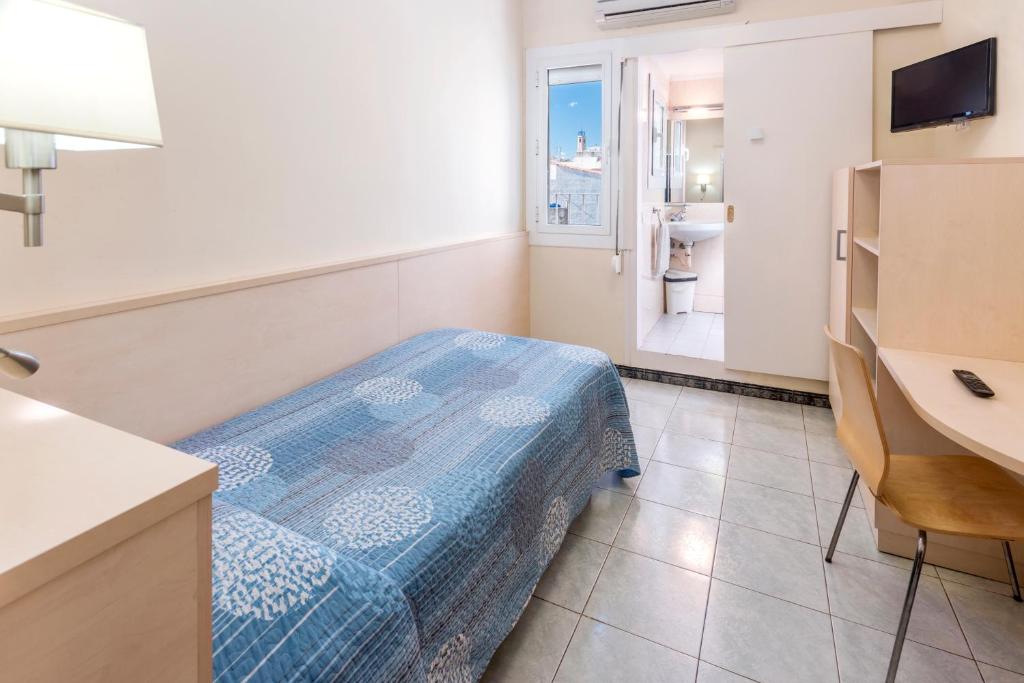 Postel nebo postele na pokoji v ubytování Hostal Solimar