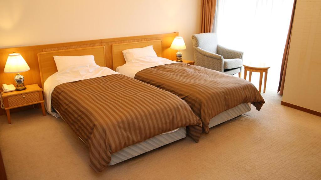 Nishiizu Crystal View Hotel客房内的一张或多张床位