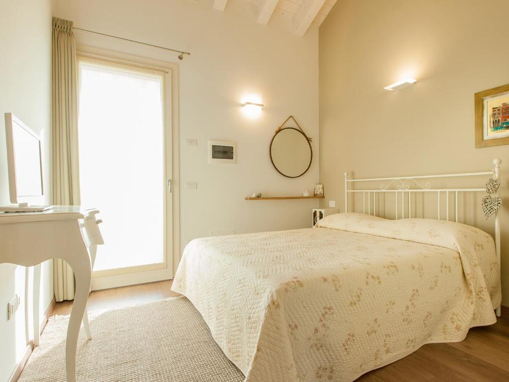 Posteľ alebo postele v izbe v ubytovaní B&B Cà Dea Calle