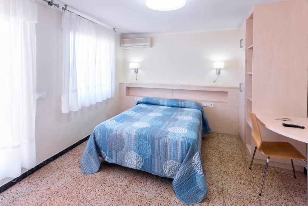 Postel nebo postele na pokoji v ubytování Hostal Solimar