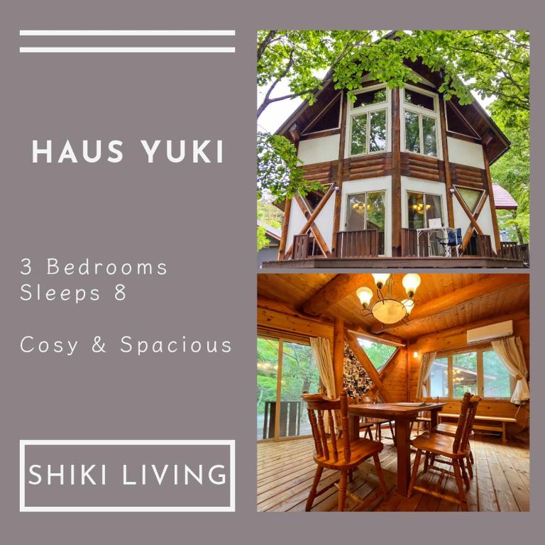 a room with a table and chairs and a house at Haus Yuki in Hakuba