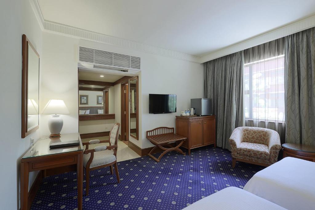 TV a/nebo společenská místnost v ubytování The Jesselton Hotel