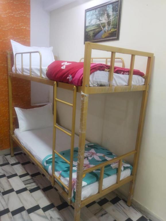 Postel nebo postele na pokoji v ubytování HOTEL HAYAT RESIDENCY