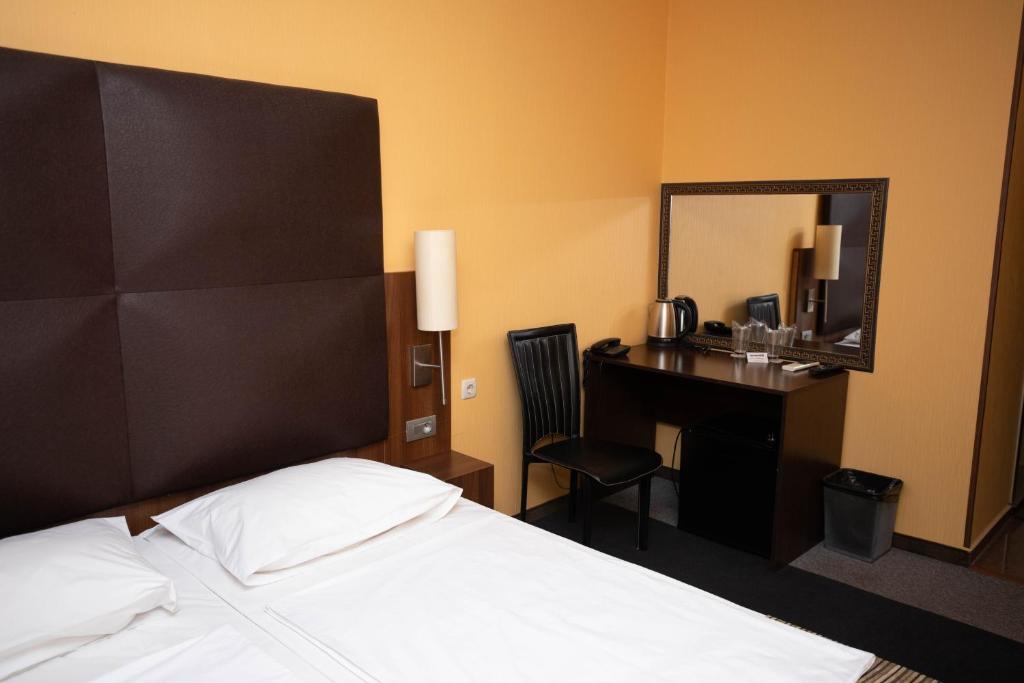 Postel nebo postele na pokoji v ubytování Formula 1 Motel