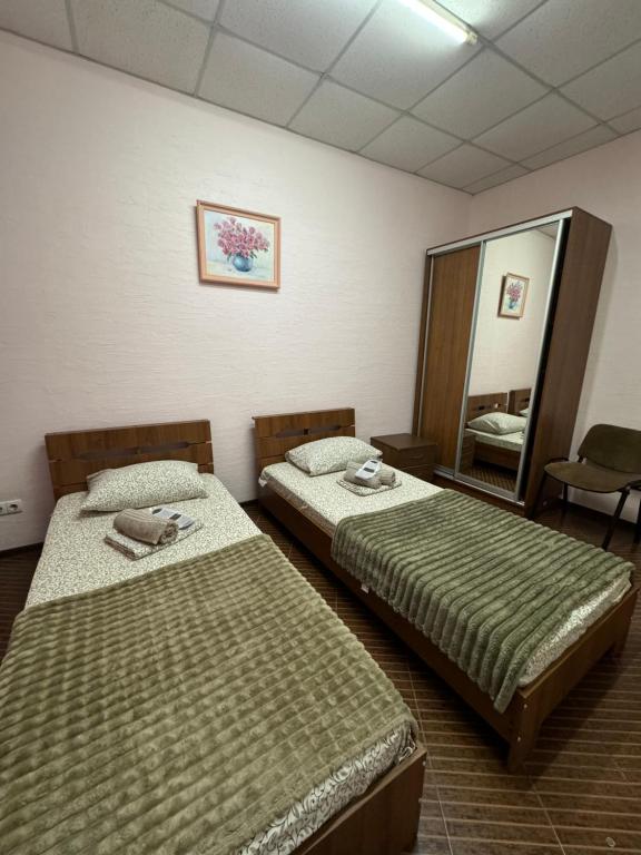 Postel nebo postele na pokoji v ubytování Guest House Na Suvorova