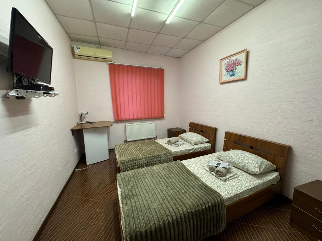 Postel nebo postele na pokoji v ubytování Guest House Na Suvorova