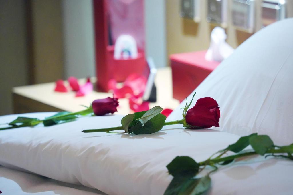 Postel nebo postele na pokoji v ubytování Redwaves Hotel فندق ريدويفز
