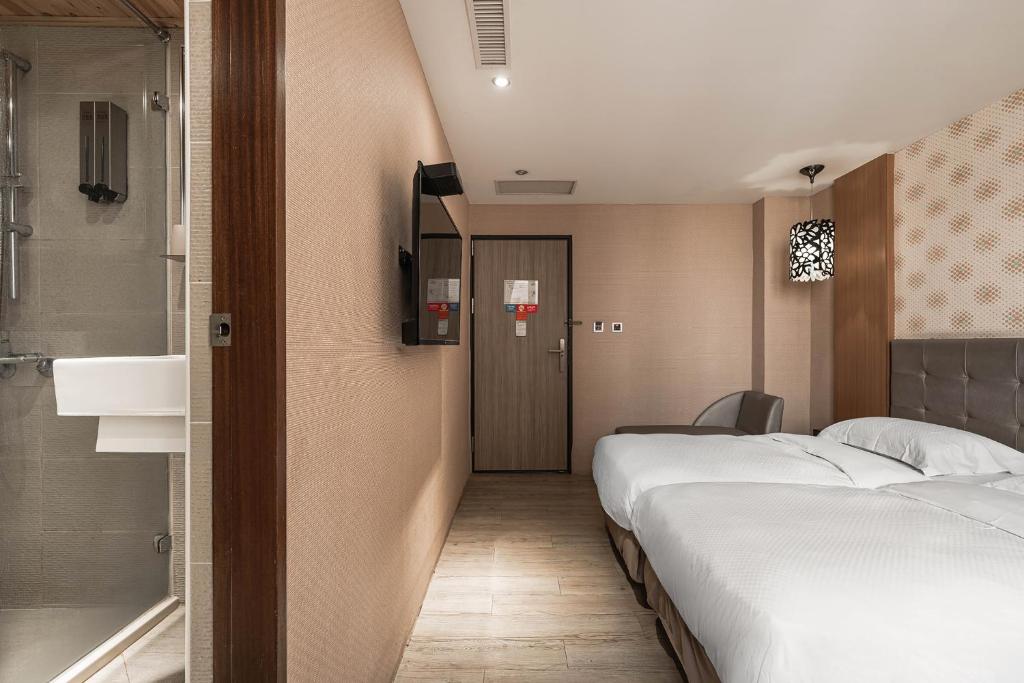 Letto o letti in una camera di The Riverside Hotel Hengchun