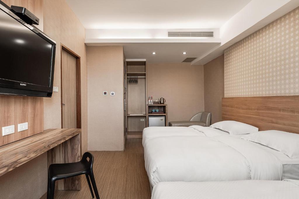 Letto o letti in una camera di The Riverside Hotel Hengchun