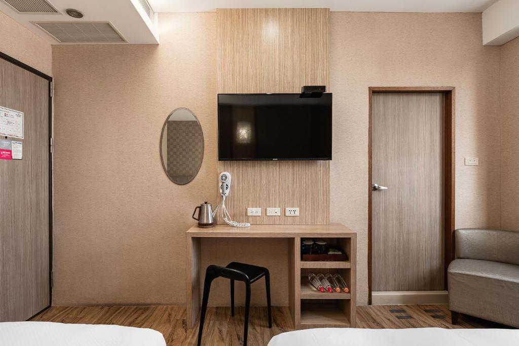 Letto o letti in una camera di The Riverside Hotel Hengchun
