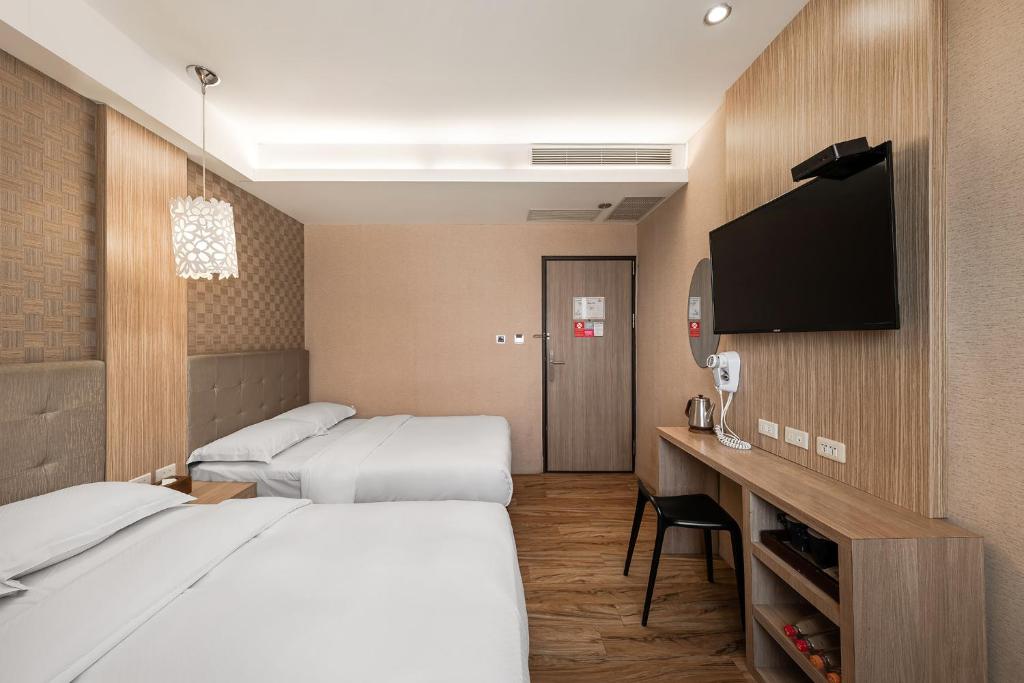 Letto o letti in una camera di The Riverside Hotel Hengchun