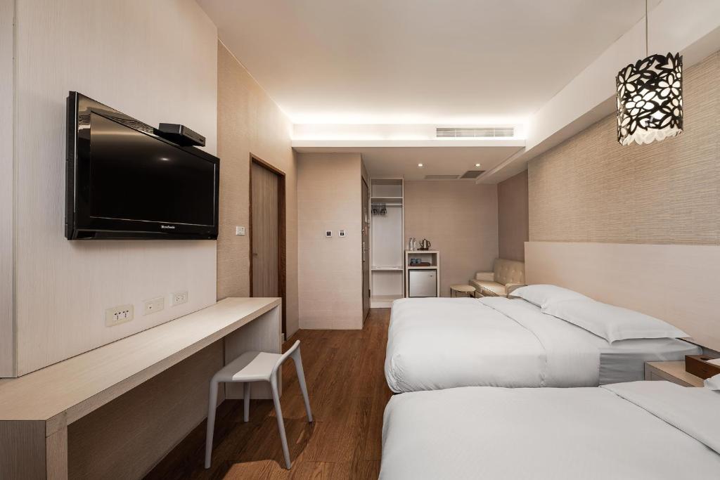 Letto o letti in una camera di The Riverside Hotel Hengchun