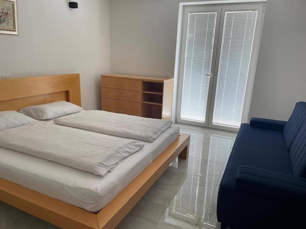 Postel nebo postele na pokoji v ubytování Apartments Julian Experience
