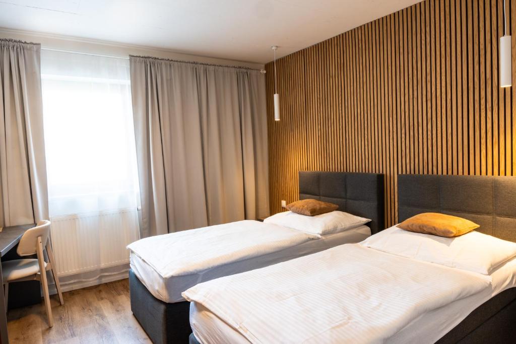 Postel nebo postele na pokoji v ubytování Hotel Sharingham