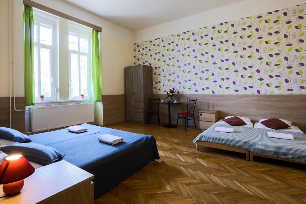 A bed or beds in a room at East Station Private Rooms