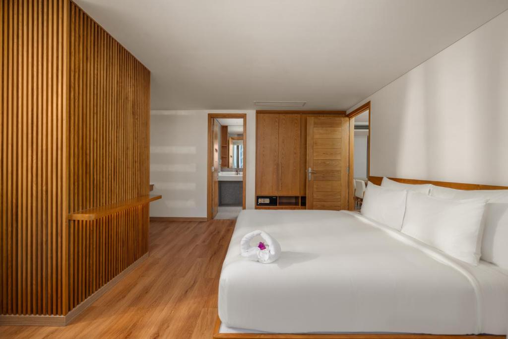 Postel nebo postele na pokoji v ubytování Vernal Hotel & Apartment Da Nang