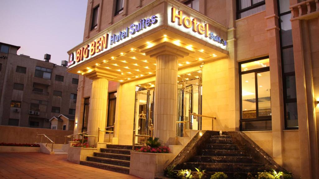 a store front of a building with lights at Big Ben Hotel Suites in Amman