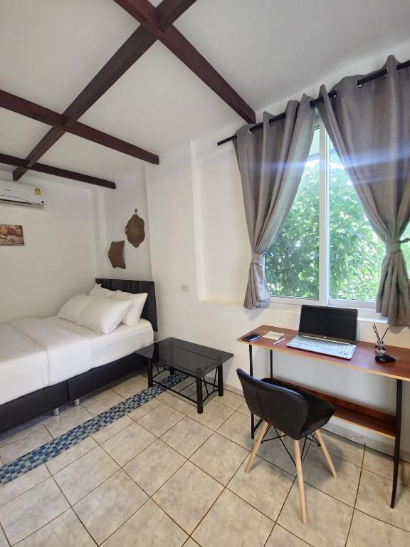 Postel nebo postele na pokoji v ubytování Koh Mak Garden View