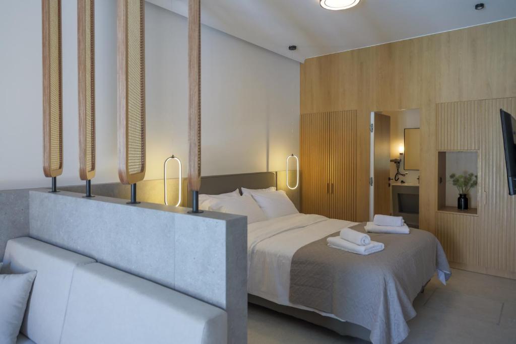 Postel nebo postele na pokoji v ubytování JM Suites by Estia