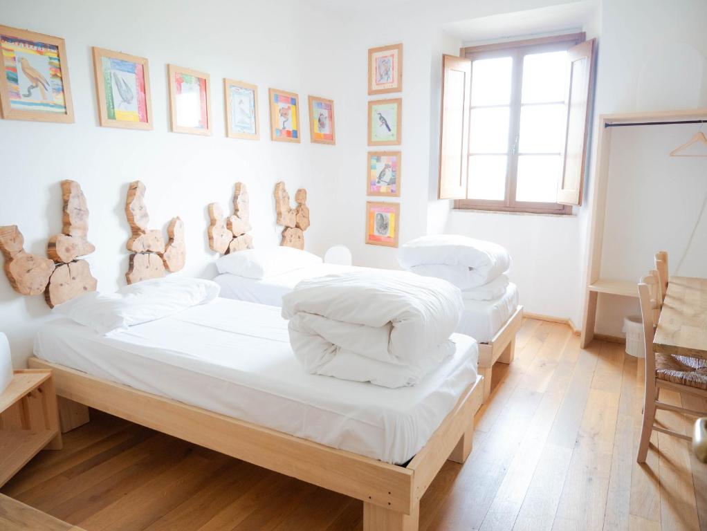 Postel nebo postele na pokoji v ubytování Ostello Bello Assisi Bevagna