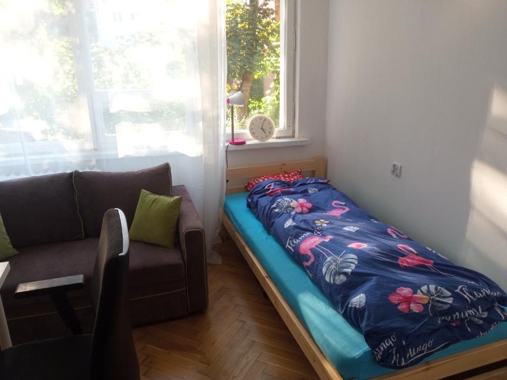 Postel nebo postele na pokoji v ubytování Słoneczny pokój na Kossaka