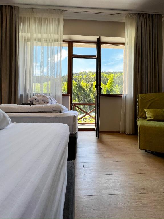 Postel nebo postele na pokoji v ubytování Hotel Skilandhouse