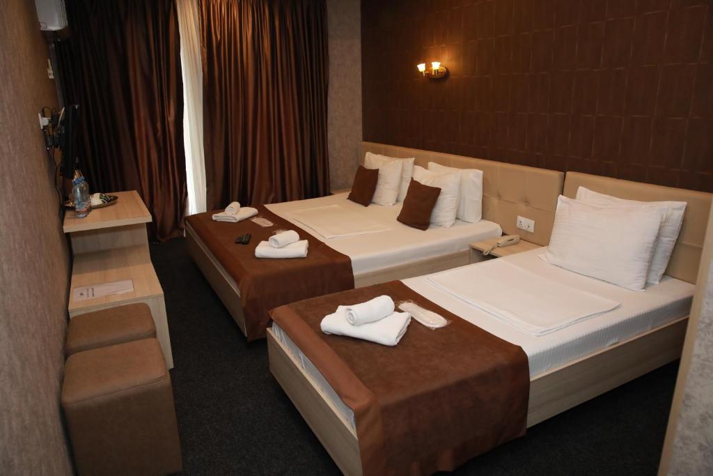 Postel nebo postele na pokoji v ubytování Hotel Voyager