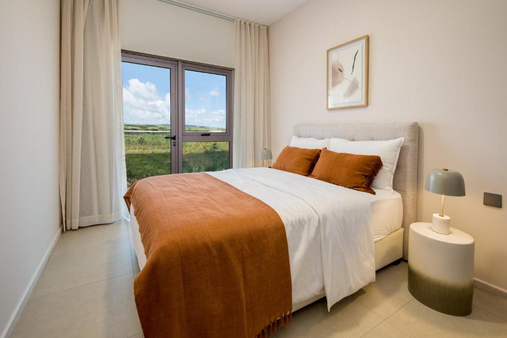 Postel nebo postele na pokoji v ubytování Minissy luxury Serviced Apartment
