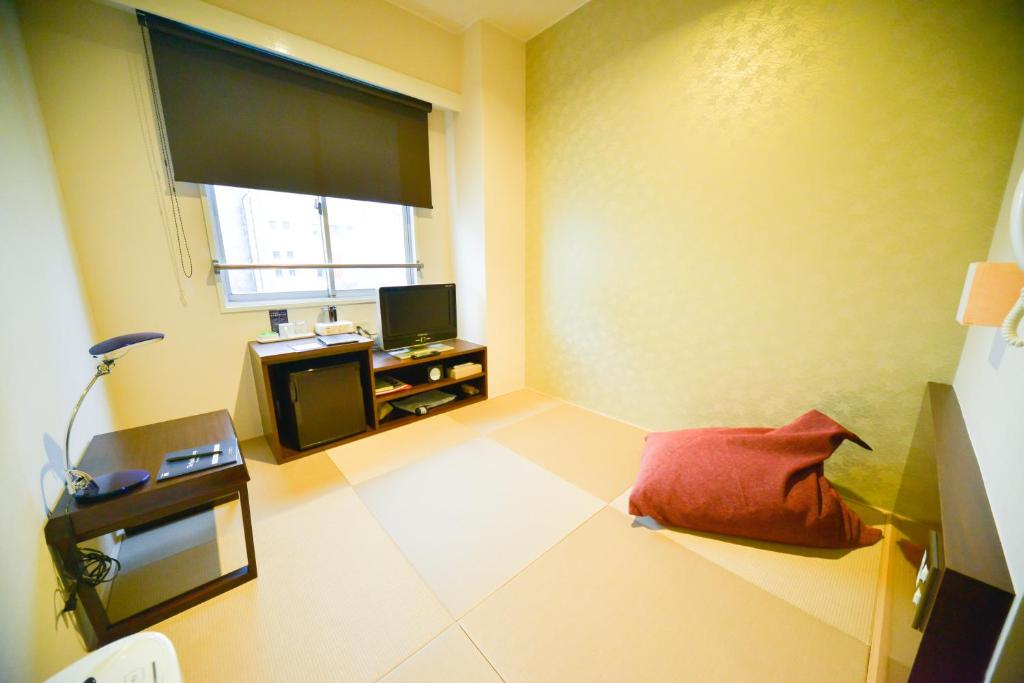Postel nebo postele na pokoji v ubytování Hotel Claire Higasa