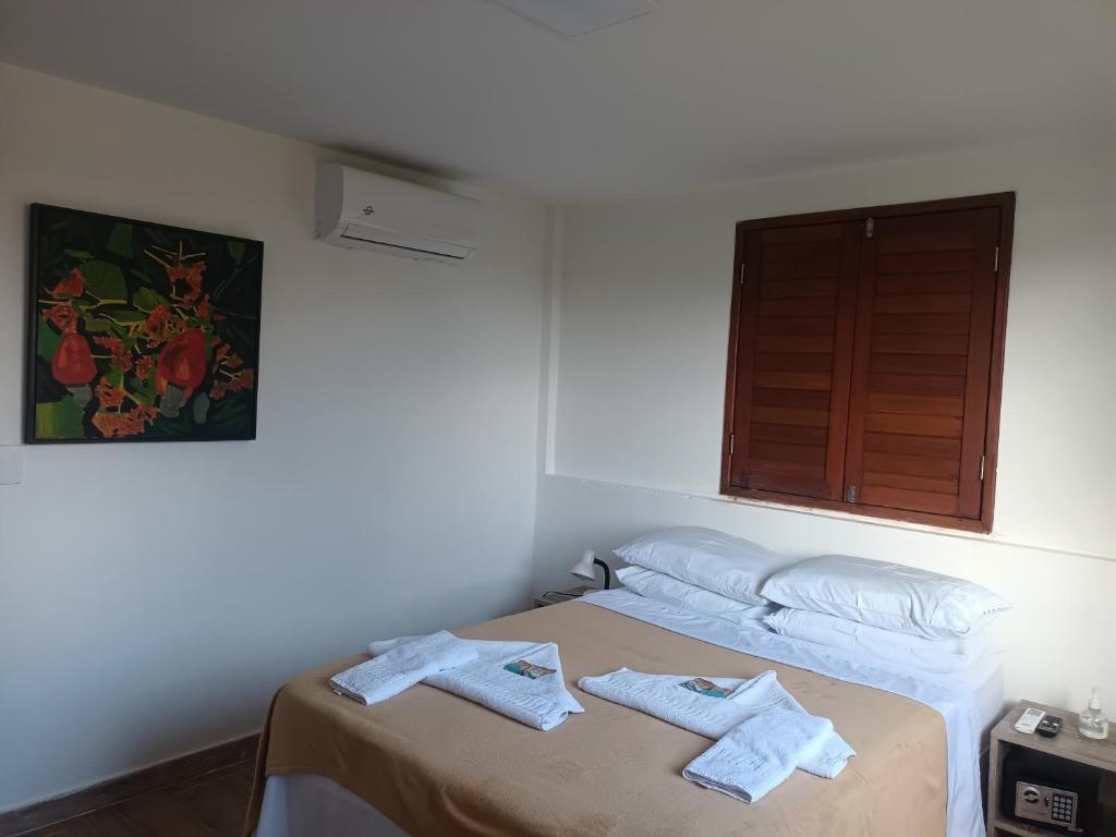 Postel nebo postele na pokoji v ubytování Pousada Vila dos Santos