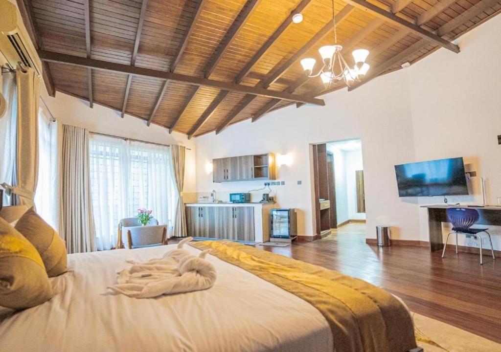 Postel nebo postele na pokoji v ubytování Light Villas Gigiri