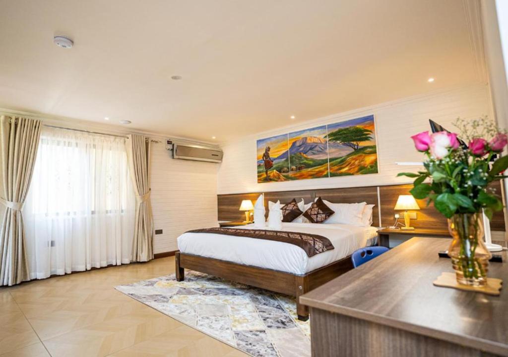 Postel nebo postele na pokoji v ubytování Light Villas Gigiri
