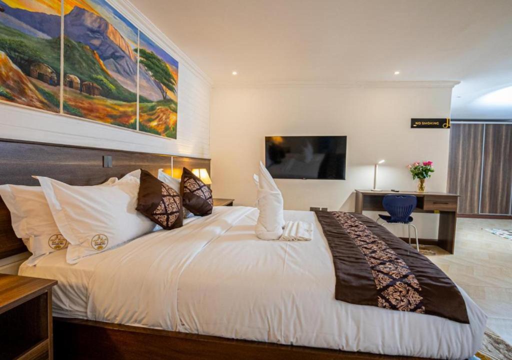 Postel nebo postele na pokoji v ubytování Light Villas Gigiri