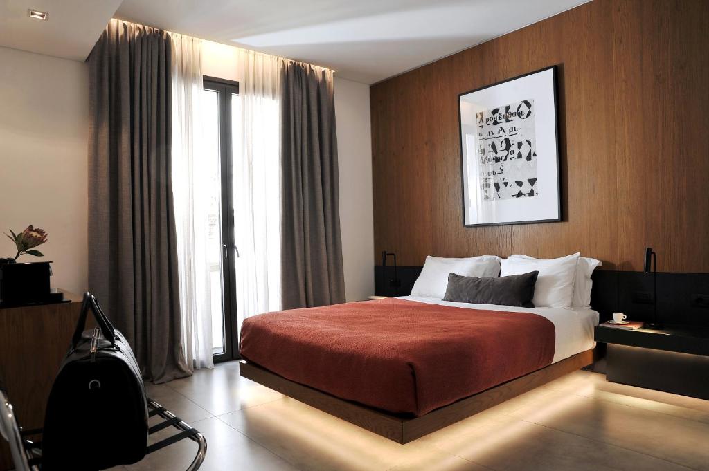 Postel nebo postele na pokoji v ubytování The Editor Hotel Athens