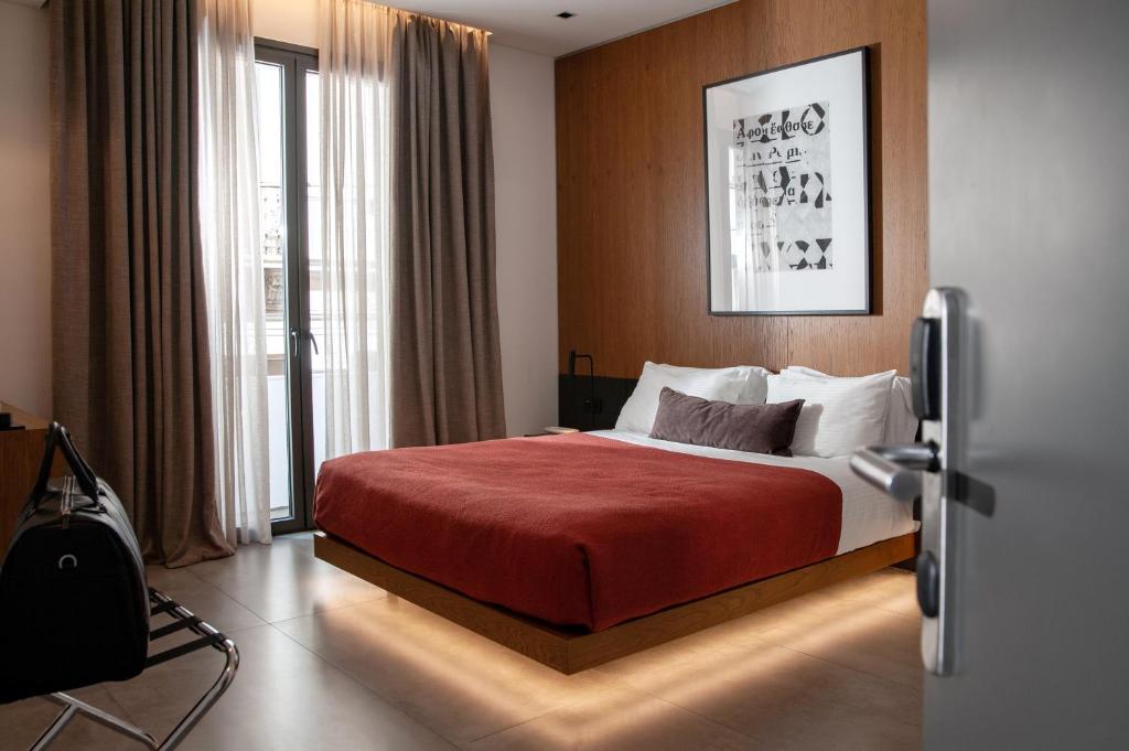 Postel nebo postele na pokoji v ubytování The Editor Hotel Athens