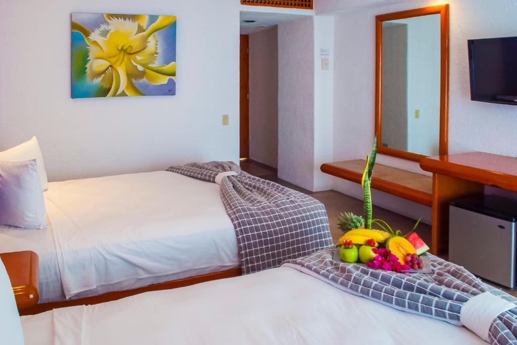 Postel nebo postele na pokoji v ubytování Hotel Los Patios