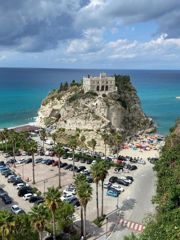 a parking lot with a castle on top of a mountain at Villa Vera Tropea - free parking in Tropea