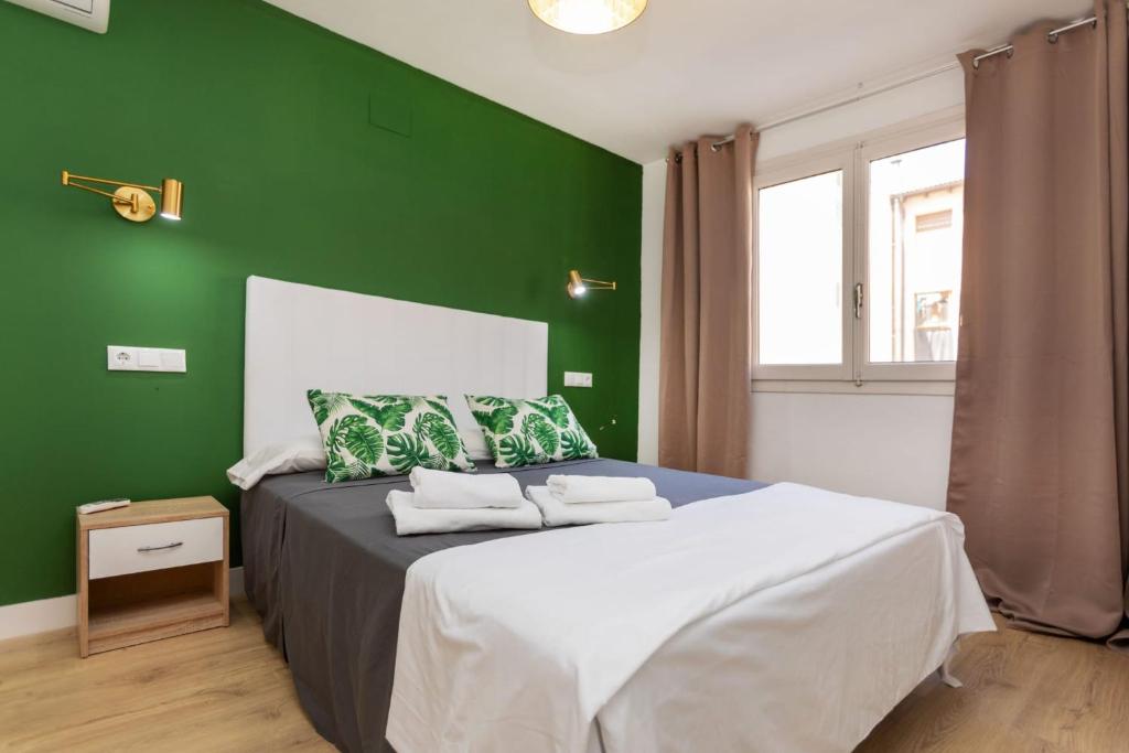 Postel nebo postele na pokoji v ubytování Apartamentos Entrepuentes