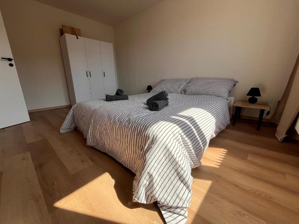 Postel nebo postele na pokoji v ubytování Apartmán Šumava