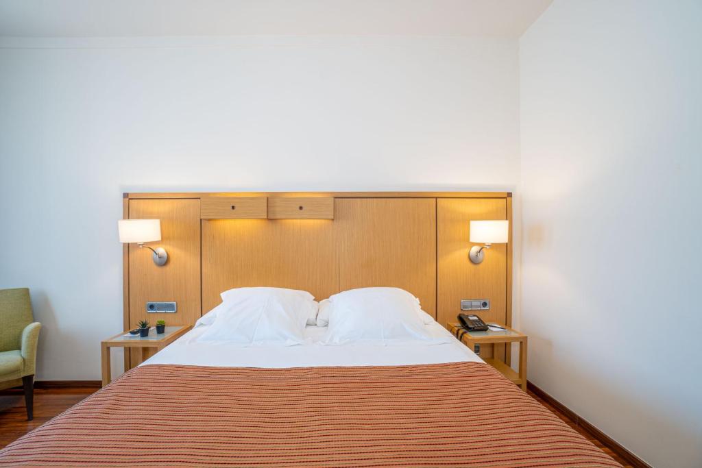 Postel nebo postele na pokoji v ubytování Hotel Duran
