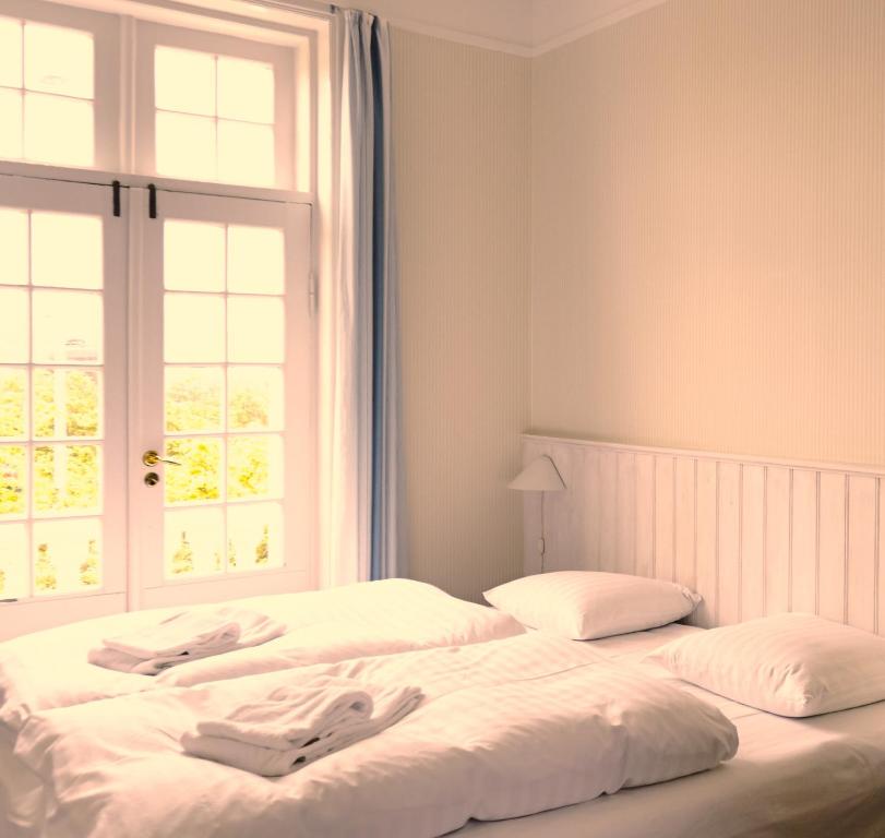 Voodi või voodid majutusasutuse Brøndums Hotel toas