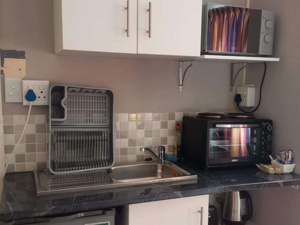 Kuchyň nebo kuchyňský kout v ubytování Angie's Nest