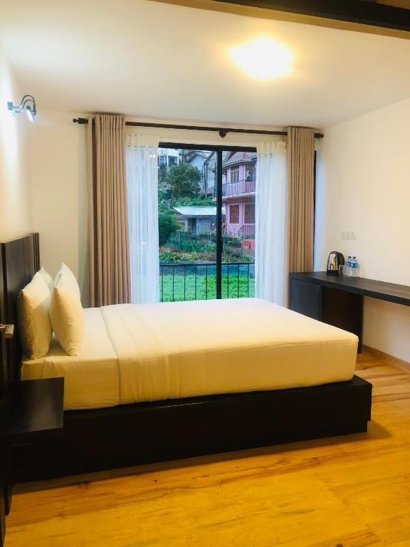Postel nebo postele na pokoji v ubytování R21 Nuwara Eliya