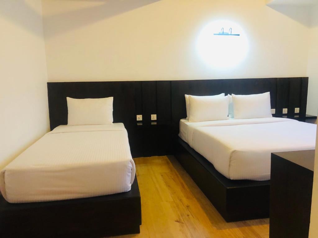 Postel nebo postele na pokoji v ubytování R21 Nuwara Eliya