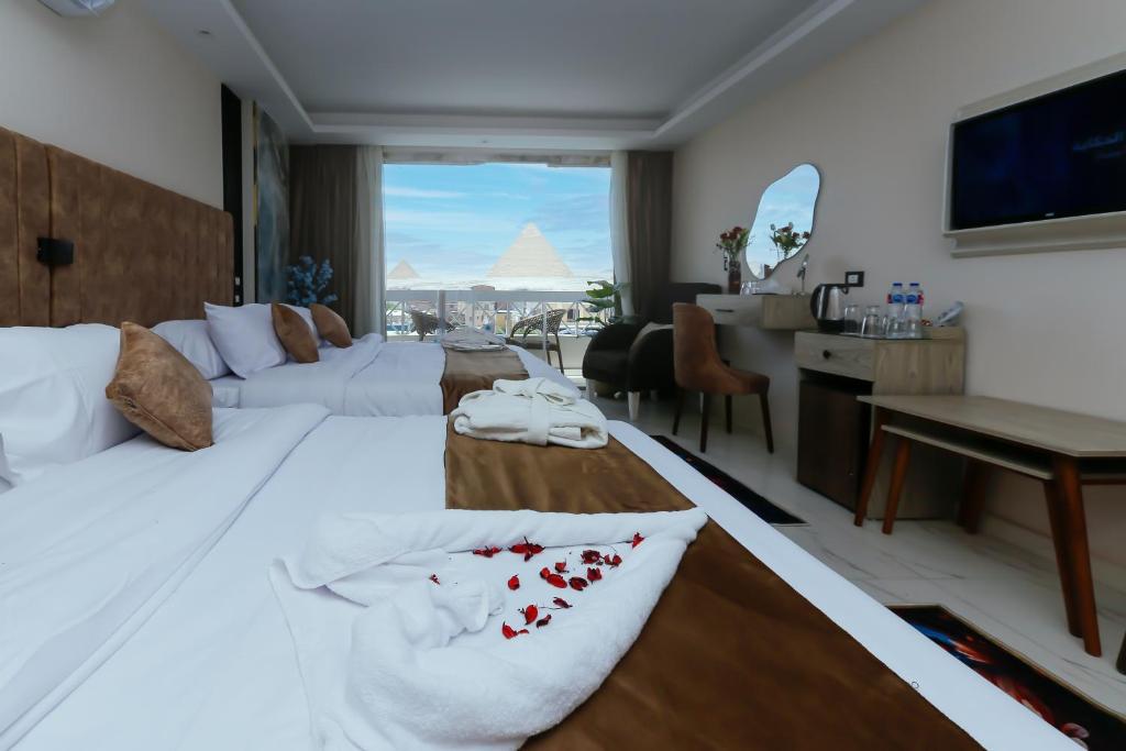 Katil atau katil-katil dalam bilik di Horizon Pyramid View INN