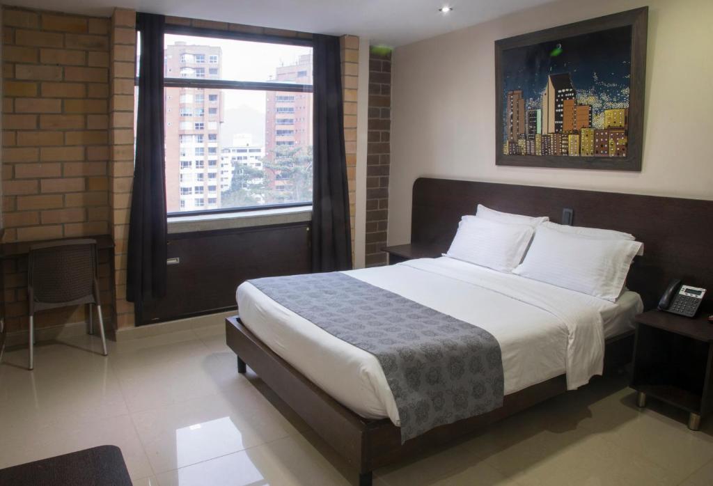 Postel nebo postele na pokoji v ubytování Hotel Acqua Medellín