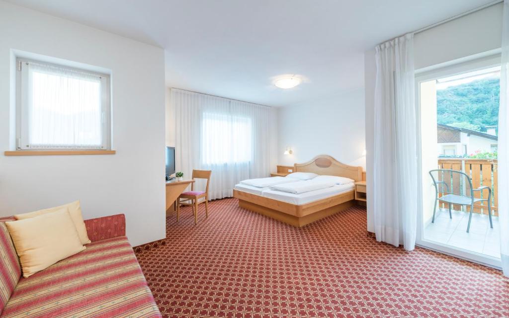 Voodi või voodid majutusasutuse Saldur Small Active Hotel toas