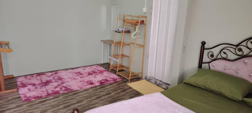 Postel nebo postele na pokoji v ubytování WM Homestay Kota Bharu